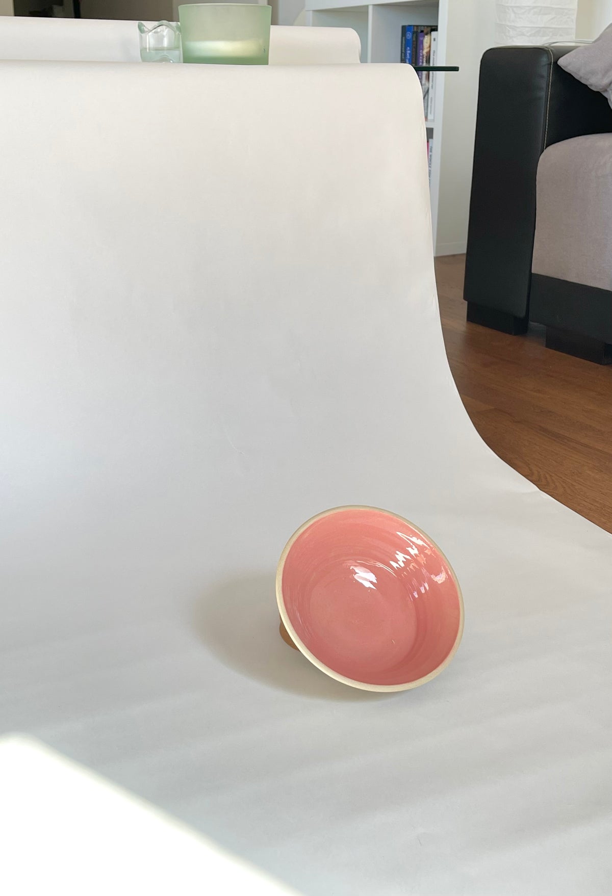 Small pink glazed ceramic bowl on white background